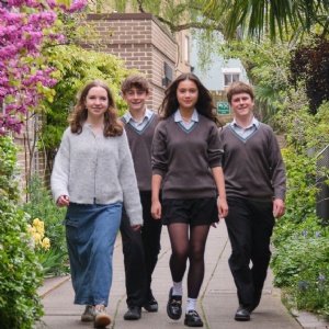 Four Stephen Perse Cambridge students walking on campus